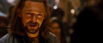 Movie still from “Prince of Persia: The Sands of Time” (2010), directed by Mike Newell – A person with long hair and a beard; Close Up shot, Over the shoulder angle