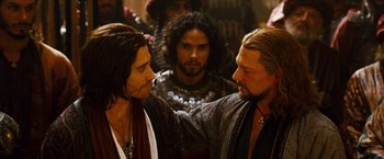 Movie still from “Prince of Persia: The Sands of Time” (2010), directed by Mike Newell – Two men in medieval garb talking to each other; Close Up shot, Over the shoulder angle