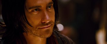 Movie still from “Prince of Persia: The Sands of Time” (2010), directed by Mike Newell – A person with long hair; Close Up shot, Over the shoulder angle