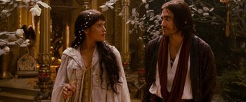 Movie still from “Prince of Persia: The Sands of Time” (2010), directed by Mike Newell – A man and a woman standing next to each other; Medium shot, Over the shoulder angle