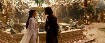 Movie still from “Prince of Persia: The Sands of Time” (2010), directed by Mike Newell – A man and a woman standing in front of a fountain; Wide shot, Over the shoulder angle