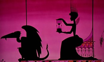 Movie still from “Princes and Princesses” (2000), directed by Michel Ocelot – A silhouette of an angel holding a hourglass and a dragon; Wide shot, Low angle