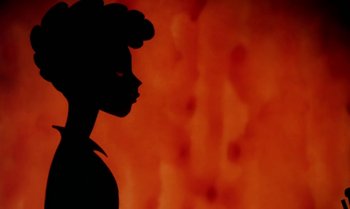 Movie still from “Princes and Princesses” (2000), directed by Michel Ocelot – A silhouette of a woman against a red background; Close Up shot, Low angle