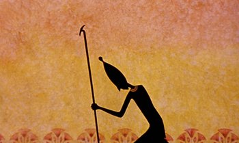 Movie still from “Princes and Princesses” (2000), directed by Michel Ocelot – An image of an egyptian figure holding a spear; Extreme Close Up shot, Low angle