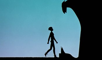 Movie still from “Princes and Princesses” (2000), directed by Michel Ocelot – Silhouette of a man walking next to a giant monster; Wide shot, Low angle