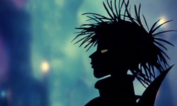 Movie still from “Princes and Princesses” (2000), directed by Michel Ocelot – A silhouette of a person with a head piece; Extreme Close Up shot, Low angle
