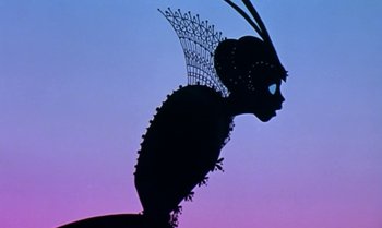 Movie still from “Princes and Princesses” (2000), directed by Michel Ocelot – A silhouette of a person wearing a headdress; Close Up shot, Low angle