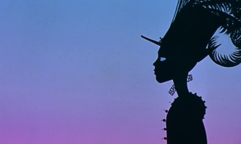 Movie still from “Princes and Princesses” (2000), directed by Michel Ocelot – The silhouette of a person is shown against a purple sky; Close Up shot, Low angle
