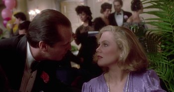 Movie still from “Prizzi's Honor” (1985), directed by John Huston – A man and a woman are looking at one another; Close Up shot, Over the shoulder angle