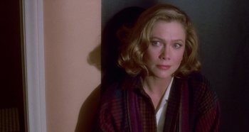 Movie still from “Prizzi's Honor” (1985), directed by John Huston – A person with short hair; Close Up shot, High angle