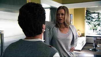 Movie still from “Project X” (2012), directed by Nima Nourizadeh – A man and a woman talking in front of a mirror; Medium shot, Over the shoulder angle