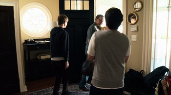 Movie still from “Project X” (2012), directed by Nima Nourizadeh – A group of people standing in front of a door; Medium shot, Over the shoulder angle