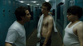 Movie still from “Project X” (2012), directed by Nima Nourizadeh – Two young men are standing in a hallway; Medium shot, Over the shoulder angle