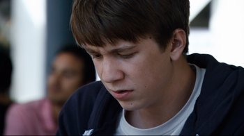 Movie still from “Project X” (2012), directed by Nima Nourizadeh – A young man looking down; Close Up shot, Over the shoulder angle