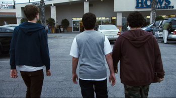 Movie still from “Project X” (2012), directed by Nima Nourizadeh – A group of young men walking down a street; Medium shot, Over the shoulder angle