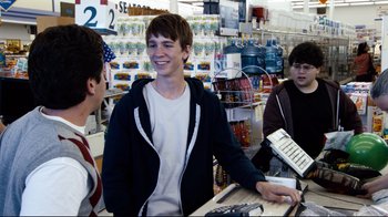 Movie still from “Project X” (2012), directed by Nima Nourizadeh – A group of young men standing around a store; Medium shot, Over the shoulder angle