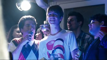 Movie still from “Project X” (2012), directed by Nima Nourizadeh – A group of young men standing around a room; Medium shot, Low angle