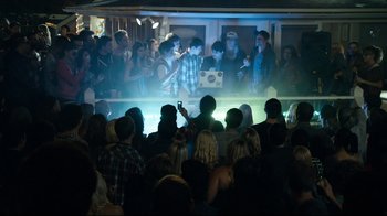 Movie still from “Project X” (2012), directed by Nima Nourizadeh – A group of people standing in front of an audience; Wide shot, High angle