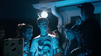Movie still from “Project X” (2012), directed by Nima Nourizadeh – A group of young people hanging out in the dark; Medium shot, Low angle