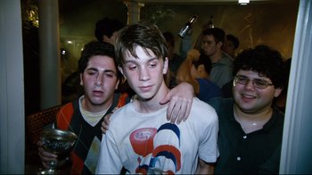 Movie still from “Project X” (2012), directed by Nima Nourizadeh – A group of young men standing next to each other in a room; Medium shot, Low angle