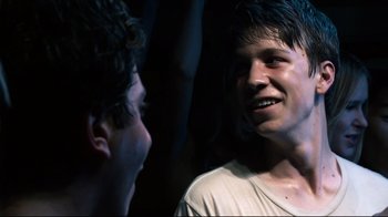 Movie still from “Project X” (2012), directed by Nima Nourizadeh – Two young men talking to each other in the dark; Close Up shot, Over the shoulder angle