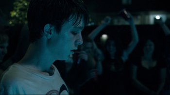 Movie still from “Project X” (2012), directed by Nima Nourizadeh – A young man is looking down at his face; Close Up shot, Low angle