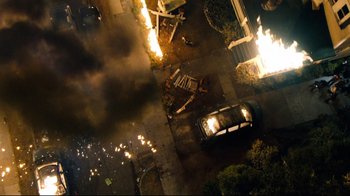 Movie still from “Project X” (2012), directed by Nima Nourizadeh – An aerial view of a car on fire; Extreme Wide shot, Overhead angle
