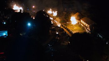 Movie still from “Project X” (2012), directed by Nima Nourizadeh – An aerial view of a street with a lot of fire in it; Extreme Wide shot, High angle