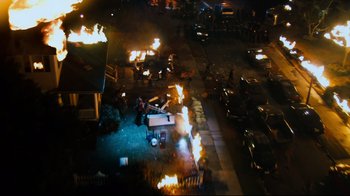 Movie still from “Project X” (2012), directed by Nima Nourizadeh – An aerial view of a street with a truck on fire; Extreme Wide shot, High angle