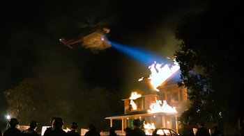 Movie still from “Project X” (2012), directed by Nima Nourizadeh – A helicopter flying over a house on fire at night; Extreme Wide shot, Low angle