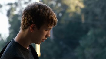Movie still from “Project X” (2012), directed by Nima Nourizadeh – A young man is looking down at his face; Close Up shot, Over the shoulder angle
