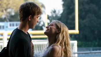 Movie still from “Project X” (2012), directed by Nima Nourizadeh – A man and a woman smiling at each other; Medium shot, Low angle