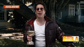 Movie still from “Project X” (2012), directed by Nima Nourizadeh – A man in a brown leather jacket holding a silver goblet; Medium shot, Low angle