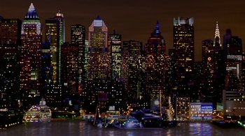 Movie still from “Prospero's Books” (1991), directed by Peter Greenaway – A view of a large city at night time; Extreme Wide shot, High angle