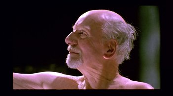 Movie still from “Prospero's Books” (1991), directed by Peter Greenaway – An old man with a white beard is looking up; Close Up shot, Low angle