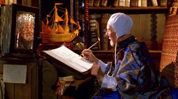 An old man writing on a book in a room