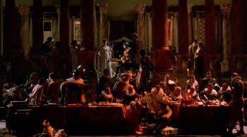 Movie still from “Prospero's Books” (1991), directed by Peter Greenaway – A group of people sitting around a dinner table; Extreme Wide shot, High angle