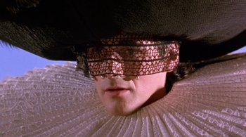 Movie still from “Prospero's Books” (1991), directed by Peter Greenaway – A man's face wearing a hat; Close Up shot, Low angle
