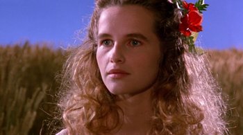Movie still from “Prospero's Books” (1991), directed by Peter Greenaway – A woman with a flower in her long hair; Close Up shot, Low angle
