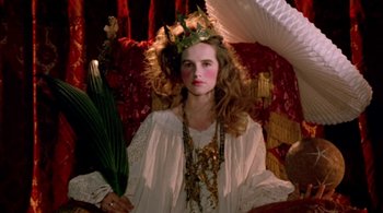 Movie still from “Prospero's Books” (1991), directed by Peter Greenaway – A woman with a crown on her head; Medium shot, Low angle