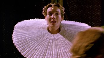 Movie still from “Prospero's Books” (1991), directed by Peter Greenaway – A woman wearing a white dress and a crown; Close Up shot, Low angle