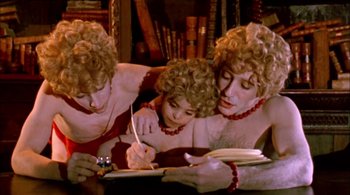 Movie still from “Prospero's Books” (1991), directed by Peter Greenaway – A group of three people sitting in a room; Medium shot, High angle