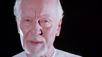 Movie still from “Prospero's Books” (1991), directed by Peter Greenaway – An older man with a beard and mustache; Close Up shot, Low angle