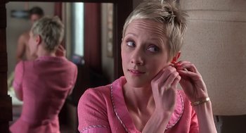 Movie still from “Psycho” (1998), directed by Gus Van Sant – A woman putting on her earrings in a mirror; Close Up shot, Over the shoulder angle