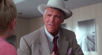 Movie still from “Psycho” (1998), directed by Gus Van Sant – An older man wearing a suit and a white hat; Close Up shot, Low angle