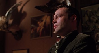 Movie still from “Psycho” (1998), directed by Gus Van Sant – A person wearing a suit and tie; Close Up shot, Low angle