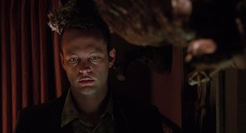 Movie still from “Psycho” (1998), directed by Gus Van Sant – A person looking at the camera; Close Up shot, Low angle