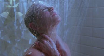 Movie still from “Psycho” (1998), directed by Gus Van Sant – A woman is taking a shower in the bathroom; Close Up shot, Low angle