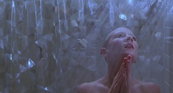 Movie still from “Psycho” (1998), directed by Gus Van Sant – A person taking a shower in a bathroom; Close Up shot, Low angle