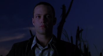 Movie still from “Psycho” (1998), directed by Gus Van Sant – A person wearing a suit and tie; Close Up shot, Low angle